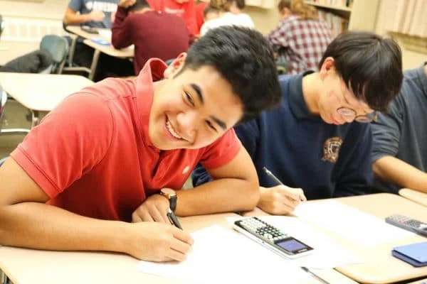 SLS students smiling in class